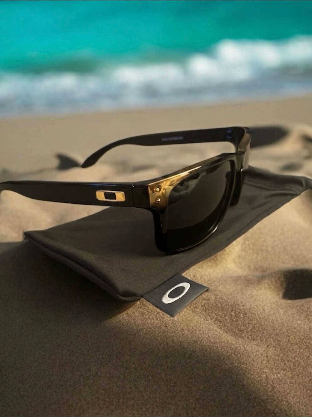 Oakley Holbrook Collection. Black/Gold frames with polarized lenses.